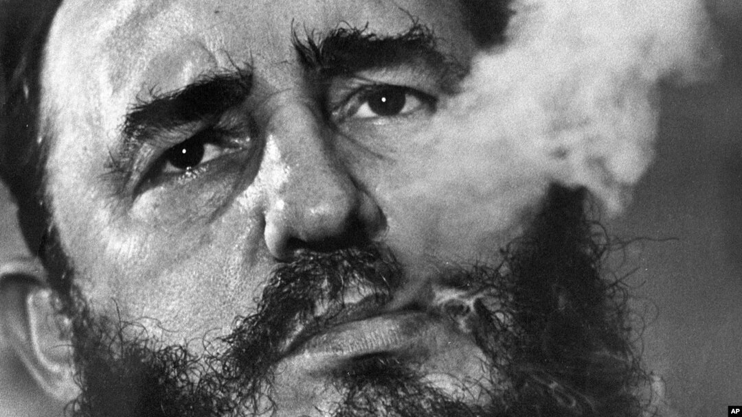 FILE - Cuban Prime Minister Fidel Castro exhales cigar smoke during an interview at his presidential palace in Havana, Cuba, March 1985. A Havana attorney who fought for the poor, Castro overthrew dictator Fulgencio Batista's government on Jan. 1, 1959.