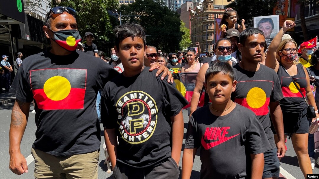 FILE - Protesters take part in a "silent march" during the "Abolish the Date" rally in Sydney, Jan. 26, 2022, to demand that Australia Day, the country's national day, be changed. 