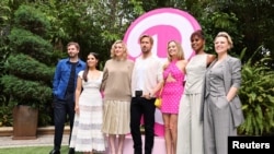 Actors Michael Cera, America Ferrera, Ryan Gosling, Margot Robbie, Issa Rae, Kate McKinnon and director Greta Gerwig pose for pictures during a photocall for the upcoming Warner Bros. movie "Barbie" in Los Angeles, California, U.S., June 25, 2023. 