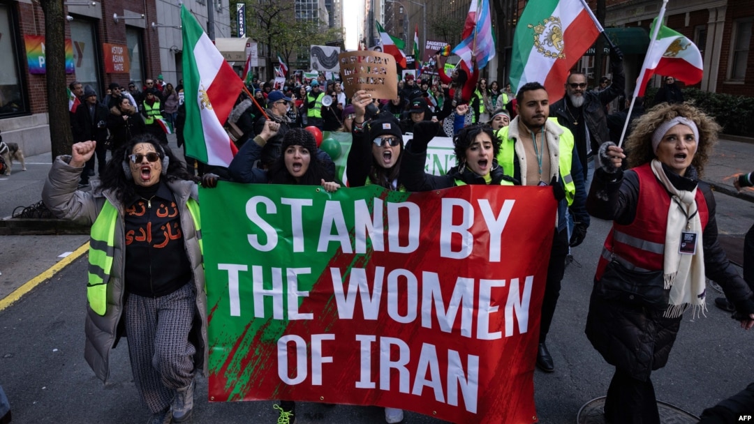 FILE - Protesters call on the United Nations to take action against the treatment of women in Iran, following the death in police custody of Mahsa Amini, during a rally in New York City, Nov. 19, 2022.