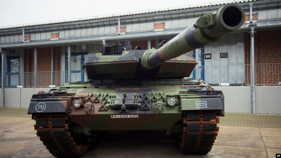 FILE - A Leopard 2 main battle tank is parking in front of a facility at the German forces Bundeswehr training area in Munster, Germany, Feb. 20, 2023. 