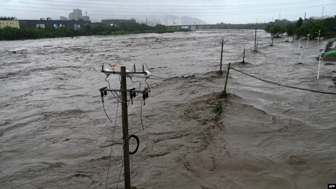 This picture shows a view of the overflooded Yongding river, after heavy rains in Mentougou district in Beijing on July 31, 2023.