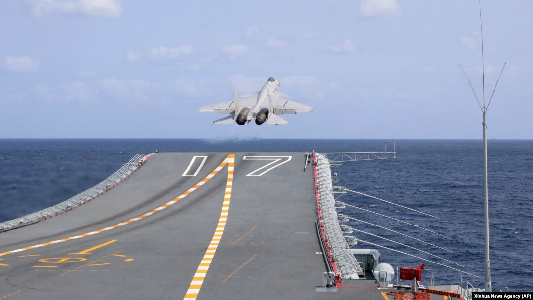 FILE - In this photo released by Xinhua News Agency, a J-15 Chinese fighter jet takes off from the Shandong aircraft carrier during military exercises around Taiwan by the Eastern Theater Command of the Chinese People's Liberation Army on April 9, 2023.