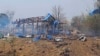 This photo provided by the Kyunhla Activists Group shows aftermath of an airstrike in Pa Zi Gyi village in Sagaing Region's Kanbalu Township, Myanmar, April 11, 2023. 