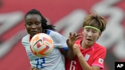 Haiti's Roselord Borgella, vies for the ball against South Korea's Lim Seon-joo during a friendly soccer match between South Korea and Haiti at Seoul World Cup Stadium in Seoul, South Korea, July 8, 2023.