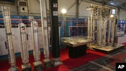 FILE - Iran's domestically built centrifuges are displayed in an exhibition of the country's nuclear achievements in Tehran, Iran, Feb. 8, 2023. A U.S. official said on Thursday that the U.S. issued fresh sanctions targeting Iran in response to "continued nuclear escalations."