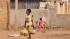 A child carries bags with bread as he walks in a street in Khartoum, Sudan, on June 20, 2023. A three-day ceasefire that ended on June 21 brought a brief respite to the capital Khartoum that has been gripped by the war that erupted on April 15.