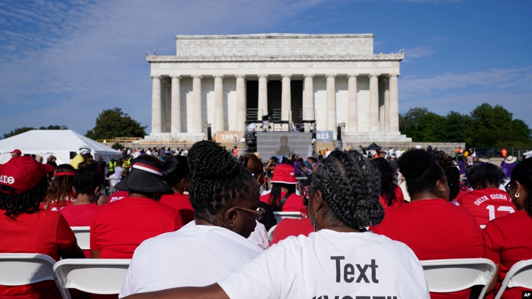 A crowd listens to speakers during an event to commemorate the 60th anniversary of the March on Washington for Jobs and Freedom at the Lincoln Memorial in Washington, Aug. 26, 2023.