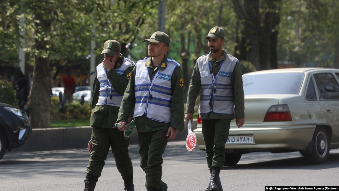 FILE- Iran police patrol a street amid the implementation of the new hijab surveillance in Tehran, Iran, April 15, 2023.