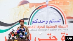 FILE - Huthi military spokesman Brigadier General Yahya Saree delivers a statement on Dec. 15, 2023. On June 25, 2024, Saree said the Houthis used a new ballistic missile in the attack on a container ship in the Gulf of Aden.