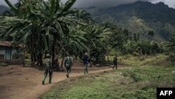 Wanajeshi wa Congo wakifanya doria katika kijiji cha Mwenda kilichoko Kaskazini Mashariki mwa DRC Mei 23, 2021. Picha na ALEXIS HUGUET / AFP.