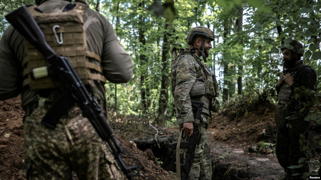 National Guard of Ukraine artillerymen wait to fire towards Russian troops, amid Russia's attack on Ukraine, near the village of Lyptsi in Kharkiv region, Ukraine June 17, 2024.