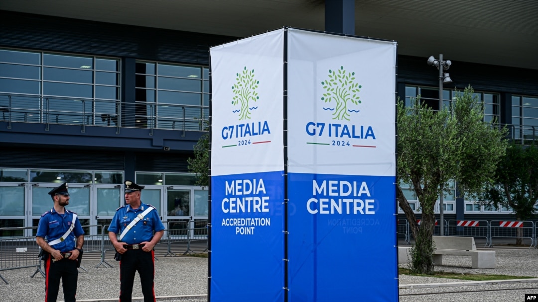 Police officers stand outside the G7 Italy 2024 media center in Bari, Italy, on June 11, 2024. 