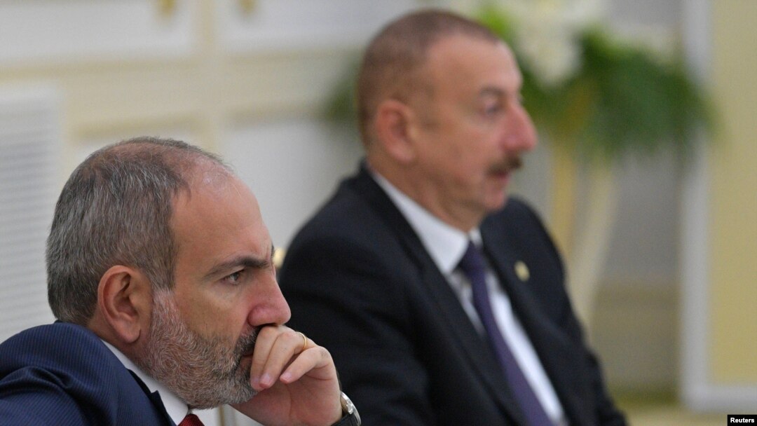 FILE - Armenia's Prime Minister Nikol Pashinyan and Azerbaijan's President Ilham Aliyev attend a meeting of heads of the Commonwealth of Independent States (CIS) in Ashgabat, Turkmenistan, October 11, 2019. 
