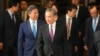 Chinese Foreign Minister Wang Yi (C) arrives at a diplomatic symposium at the Diaoyutai State Guesthouse in Beijing, Oct. 24, 2023. Wang arrived in Washington on Oct. 26 for meetings with senior U.S. officials on bilateral and regional security issues.