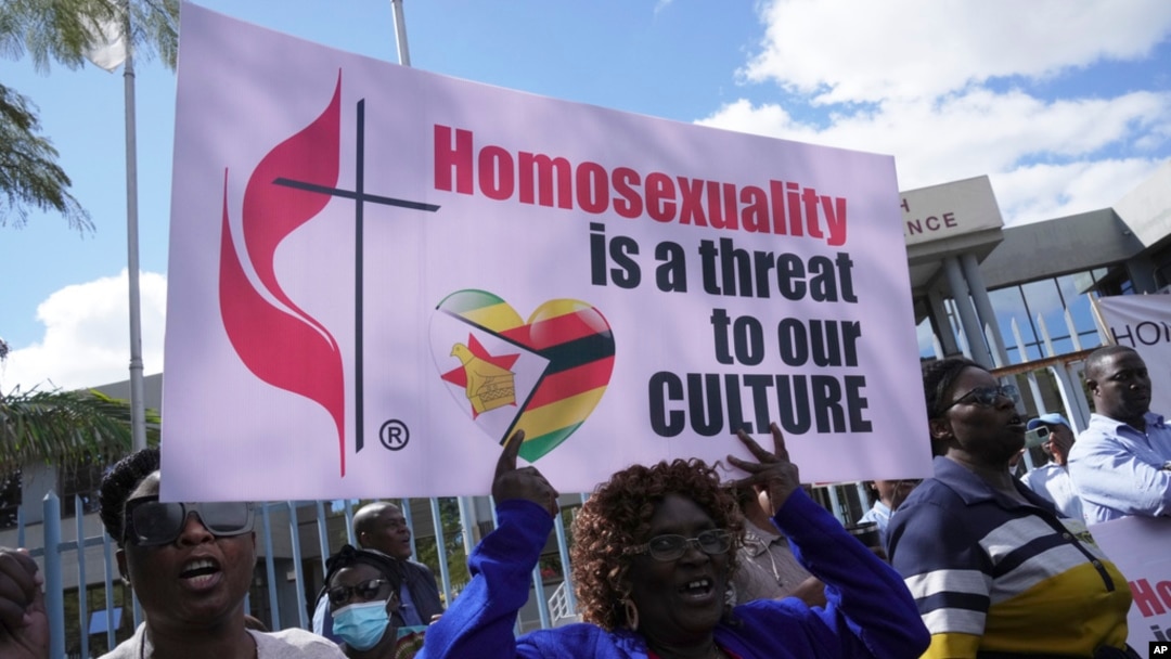 Members of the United Methodist Church in Zimbabwe hold placards while protesting at the church premises in Harare, May 30, 2024. 