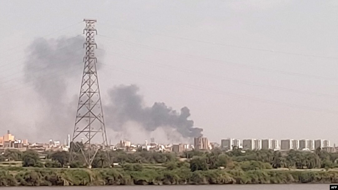 FILE - A picture taken from Omdurman shows smoke billowing north of Khartoum, Sudan, July 22, 2023, as fighting between the country's army and a rival military faction continues.
