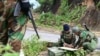 FILE - This photo taken on December 13, 2023, shows members of ethnic minority armed group Ta'ang National Liberation Army preparing their weapons amid clashes with Myanmar's military in Namhsan Township in Myanmar's northern Shan State.