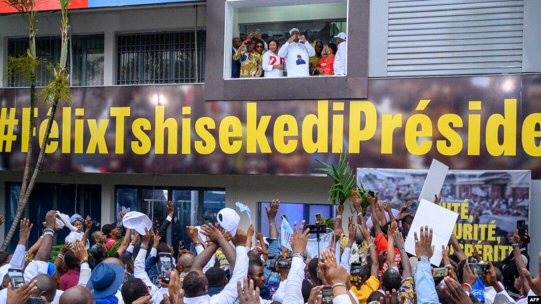 FILE - Democratic Republic of Congo President Felix Tshisekedi, with first lady Denise Nyakero at his side, greets supporters after the announcement of election results at QG Fatshi 20, the headquarters of his reelection campaign, in Gombe, Dec 31, 2023.
