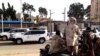 A grab taken from an AFPTV video shows a convoy leaving Khartoum towards Port Sudan, on Apr. 23, 2023, as people flee the battle-torn Sudanese capital.