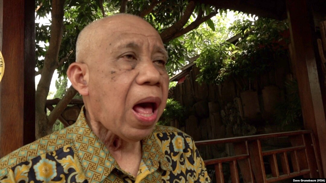 Hotib practices speaking. A cancer diagnosis led to his larynx being removed after smoking for almost four-decades.