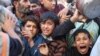 Palestinians line up for food in Rafah, Gaza Strip, Nov. 30, 2023, during a temporary ceasefire between Israel and Hamas.