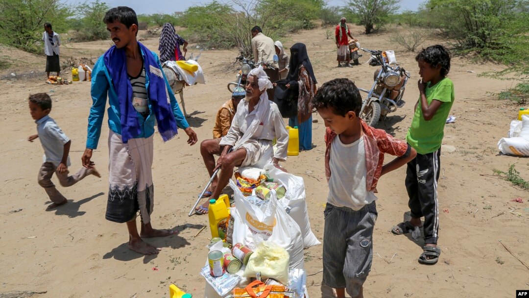 Displaced Yemenis receive humanitarian aid in the Hays region, south of Hodeidah governorate, Yemen, Aug. 16, 2024. Malnutrition is rampant in the country's government-controlled areas.