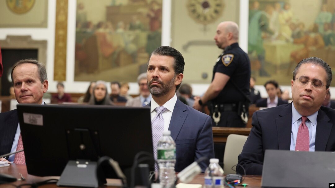 Donald Trump Jr. sits in the courtroom with his legal team before the continuation of a civil business fraud trial at New York Supreme Court, in New York, Nov. 13, 2023.