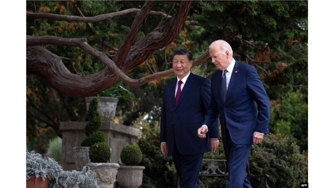 Chinese President Xi Jinping talks with U.S. President Joe Biden after meeting in Woodside, California, on Nov. 15, 2023.