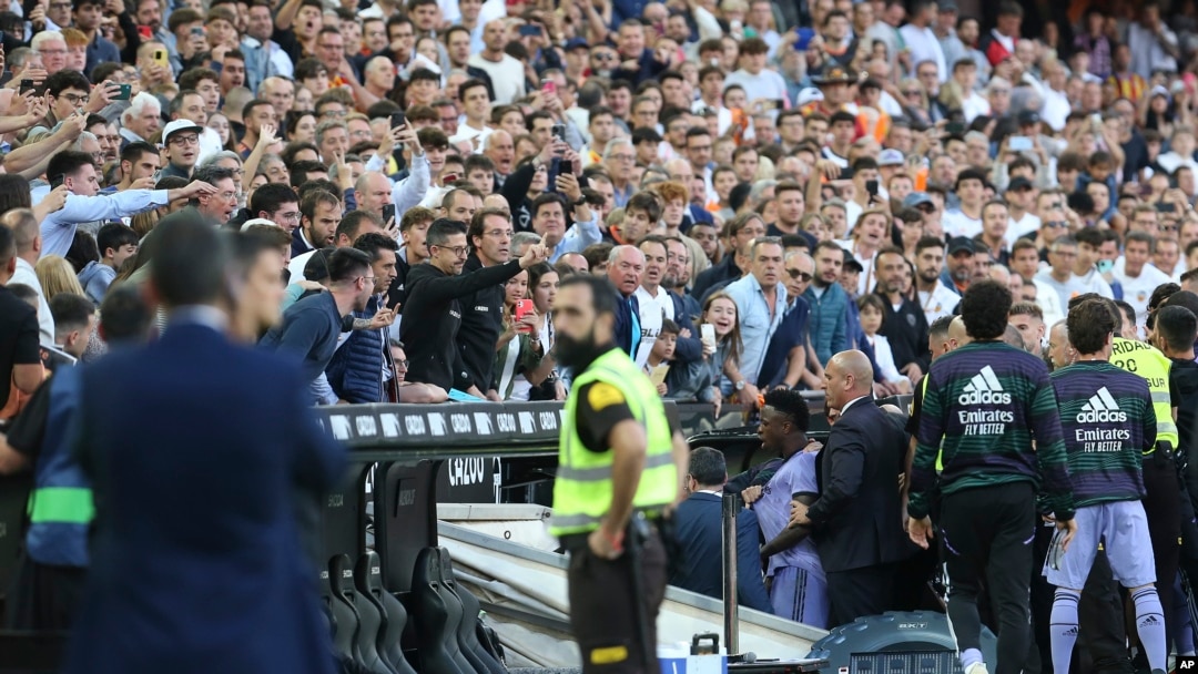 FILE - Real Madrid's Vinicius Junior, center, leaves the pitch after being shown a red card during a Spanish La Liga soccer match between Valencia and Real Madrid, at the Mestalla stadium in Valencia, Spain, May 21, 2023.
