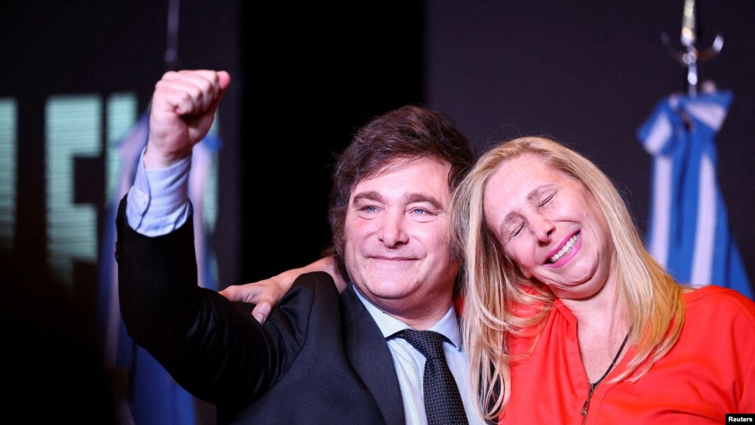 Argentine president-elect Javier Milei and his sister Karina Milei react to the results of the runoff presidential election, in Buenos Aires, Nov. 19, 2023. (REUTERS/Agustin Marcarian)