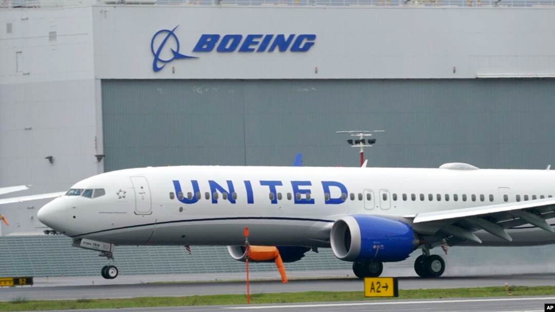 FILE - A Boeing 737 Max 9 built for United Airlines lands at King County International Airport - Boeing Field after a test flight, in Seattle, Nov. 18, 2020.