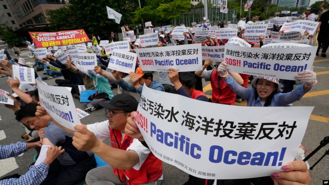 South Korean fishermen stage a rally against the planned release of treated radioactive water from the wrecked Fukushima nuclear power plant, in front of the National Assembly in Seoul, South Korea, Monday, June 12, 2023. (AP Photo/Ahn Young-joon)