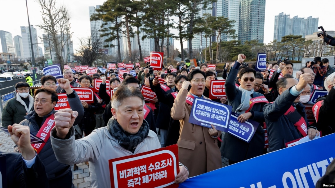 FILE - South Korean doctors take part in a protest against the government medical policy in front of the presidential office in Seoul, South Korea, Feb. 25, 2024.