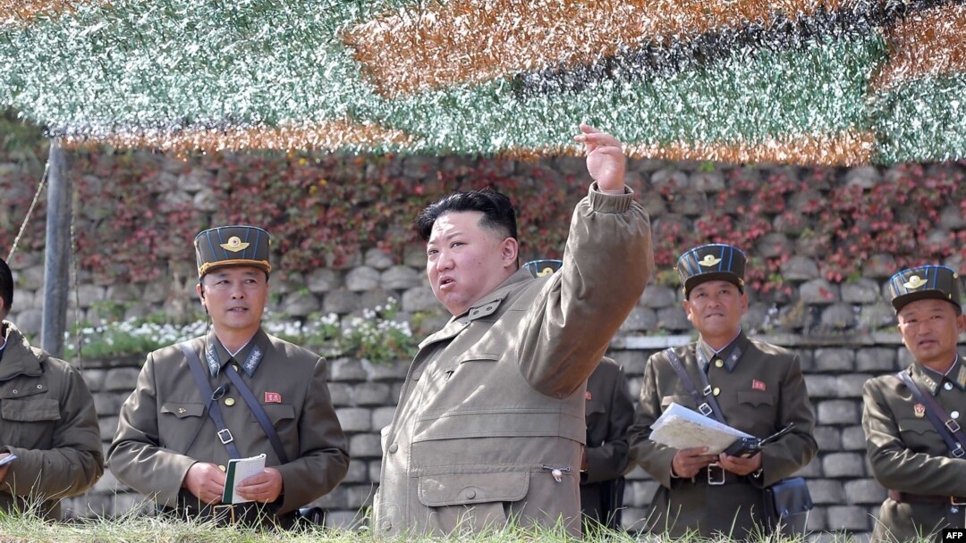 File - This picture taken on Oct. 8, 2022, and released by North Korea's official Korean Central News Agency (KCNA) on Oct. 10, 2022, shows North Korea's leader Kim Jong Un, center, attending a large-scale air attack training exercise.