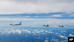 FILE - In this photo released by Xinhua News Agency, aircraft of the Eastern Theater Command of the Chinese People's Liberation Army conduct a joint combat training exercise around Taiwan, Aug. 7, 2022, shortly after U.S. Speaker of the House Nancy Pelosi visited the island.