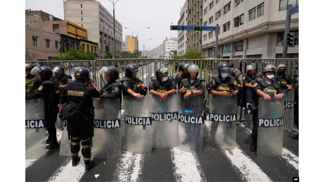 Police block a street that leads to Congress after Peruvian President Pedro Castillo dissolved the body on the day lawmakers planned an impeachment vote on him in Lima, Peru, Dec. 7, 2022.