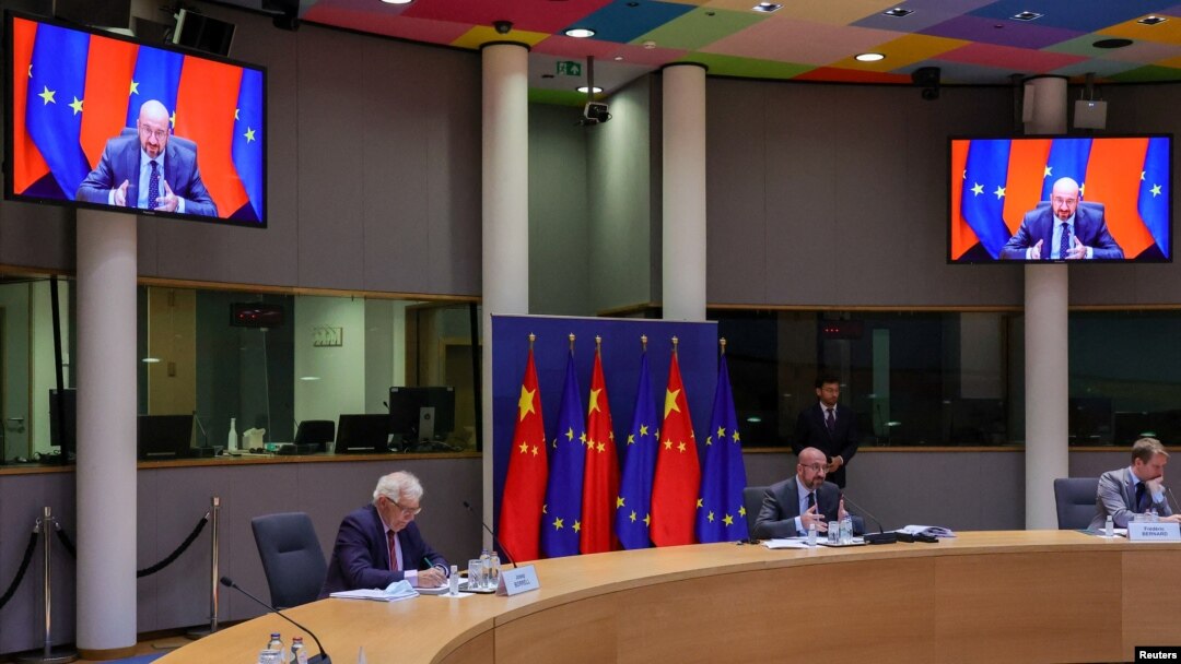FILE - European Union foreign policy chief Josep Borrell, left, and European Council President Charles Michel participate in a virtual EU China summit at the European Council building in Brussels, Belgium, April 1, 2022.