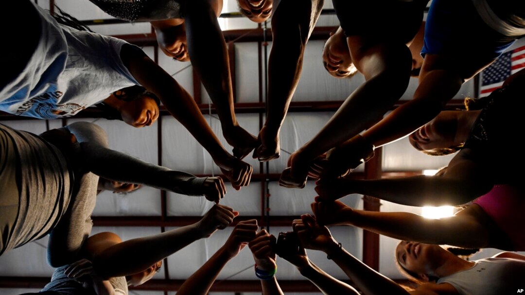 Fisk University gymnastics team gathers in a circle for a cheer during practice at the Nashville Gymnastics Training Center on Dec. 28, 2022, in Nashville, Tenn.