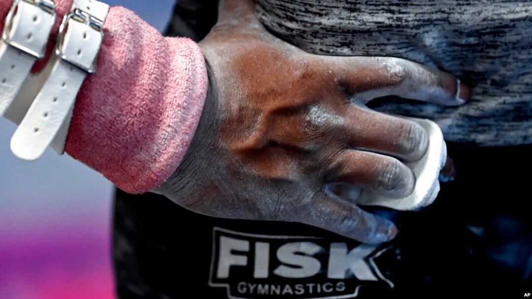 Fisk University gymnast Zyia Coleman waits to perform her uneven bars routine during a team practice at the Nashville Gymnastics Training Center, Dec. 28, 2022, in Nashville, Tenn.