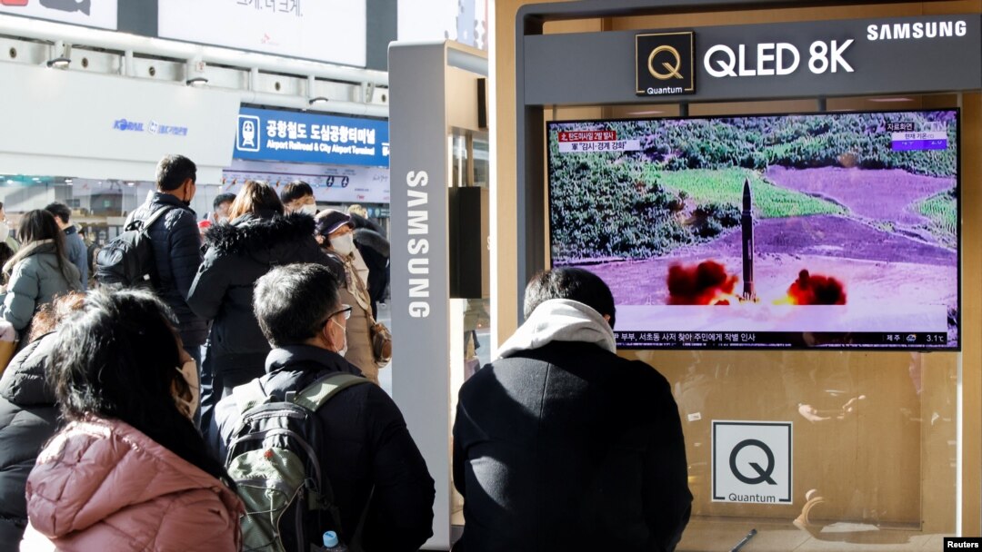 People watch a TV broadcasting a news report on North Korea firing a ballistic missile off its east coast, in Seoul, South Korea, Dec. 18, 2022.