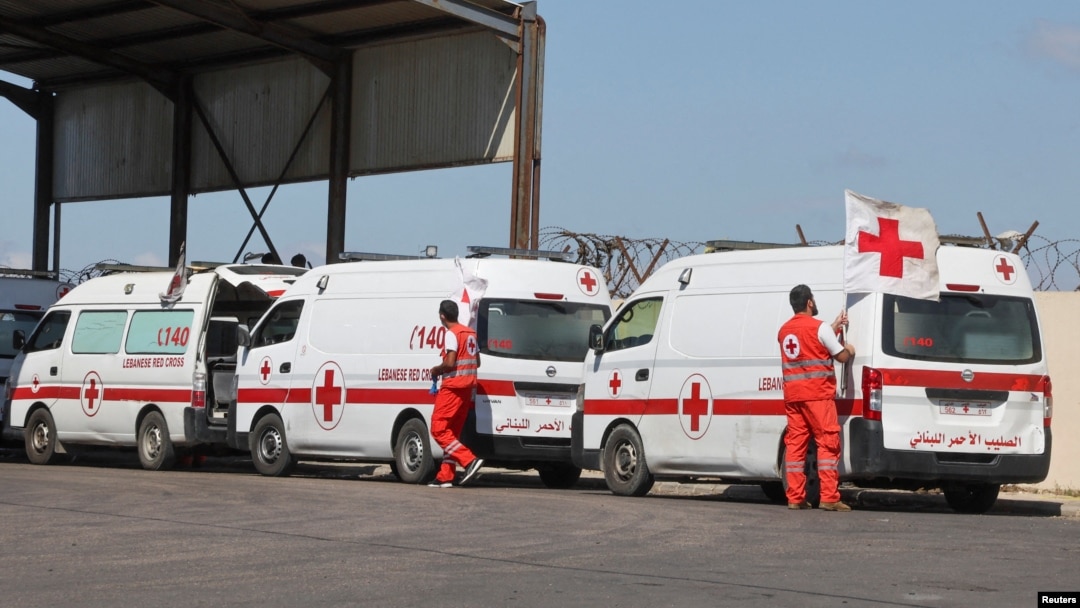 FILE - Lebanese Red Cross vehicles are parked at the Lebanese-Syrian border crossing in Arida, Lebanon, Sept. 23, 2022.