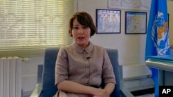 FILE - Dr. Akjemal Magtymova, the World Health Organization's representative in Syria, speaks during an interview at her office in Damascus, Syria, Tuesday, Feb. 2, 2021. 