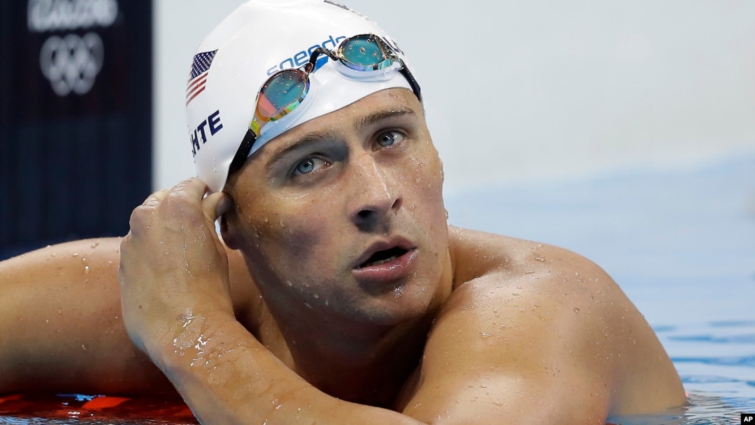 United States' Ryan Lochte checks his time in a men's 4x200-meter freestyle heat during the swimming competitions at the 2016 Summer Olympics, in Rio de Janeiro, Brazil, Aug. 9, 2016.