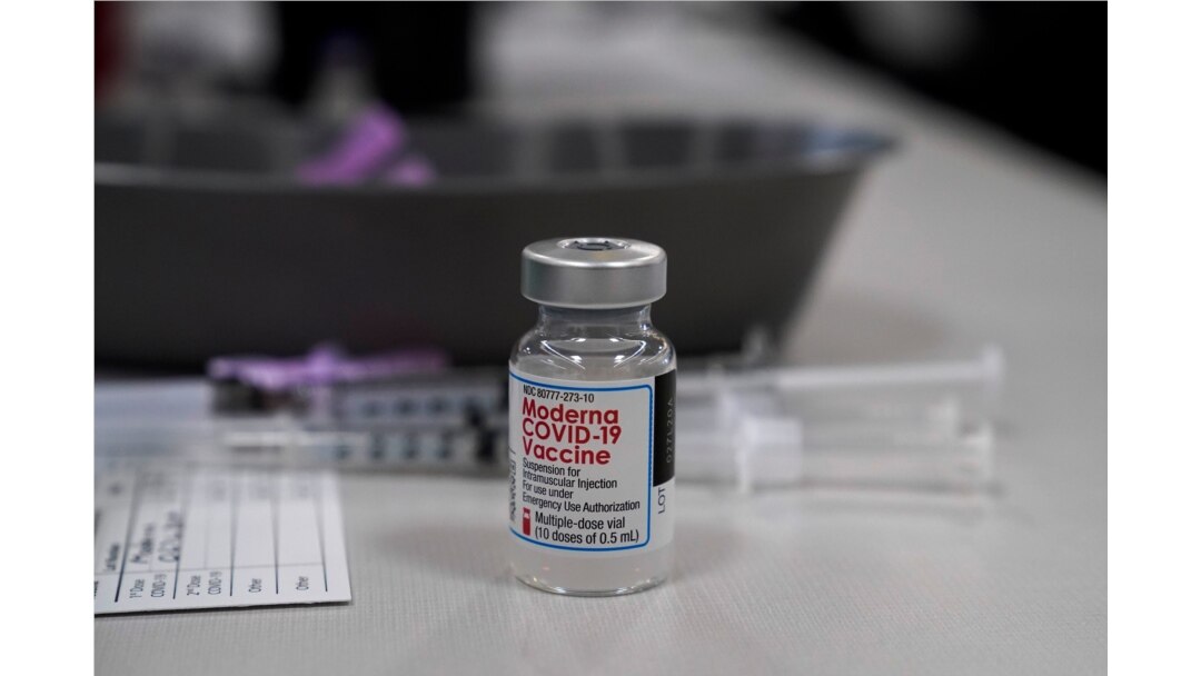 A vile of Moderna COVID-19 vaccine is seen at an ambulance company in Santa Fe Springs, Calif., an. 9, 2021.