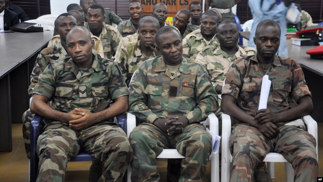 FILE - Soldiers accused of refusing to fight in the country's northeastern Islamic uprising appear before a court-martial in Abuja, Nigeria, Oct. 15, 2014.