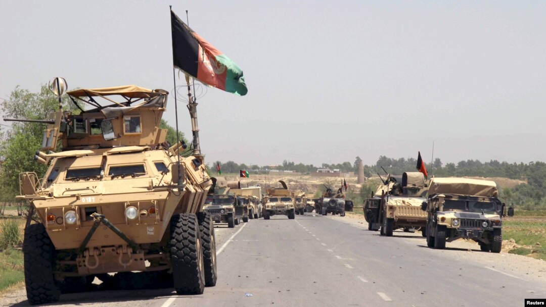 FILE - Afghan forces prepare for battle with Taliban on the outskirts of Kunduz city, northern Afghanistan, June 21, 2015. 