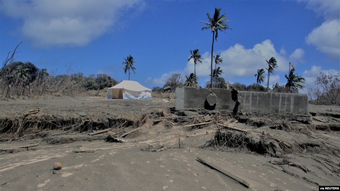 FILE - A general view shows damaged buildings and landscape covered with ash following the volcanic eruption and tsunami in Kanokupolu, Tonga, Jan. 23,2022. (Tonga Red Cross Society/Handout via Reuters)