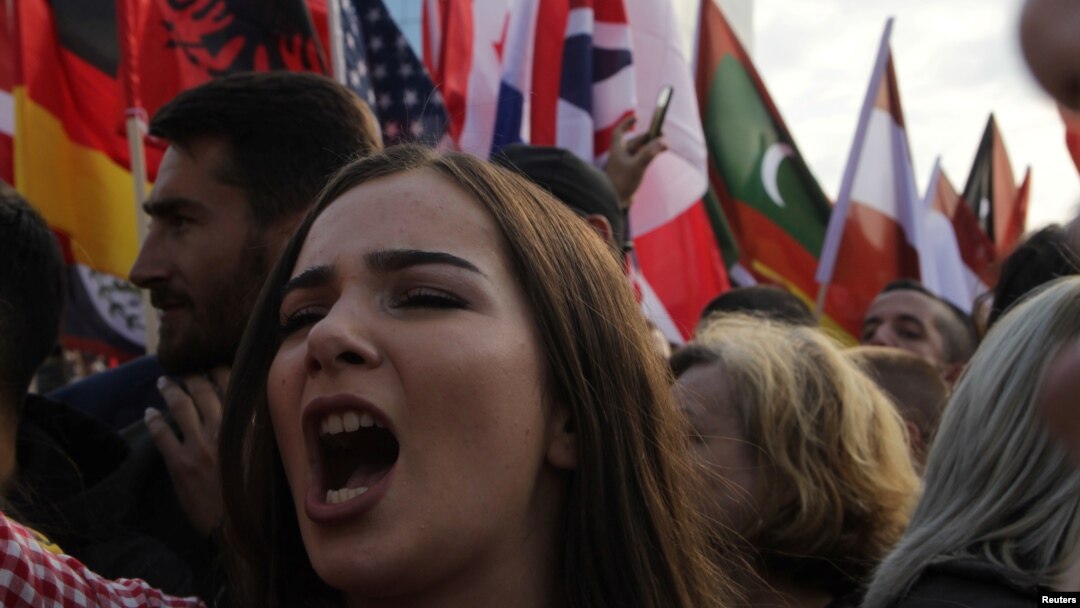 A women shouts as people protest against Kosovo President Hashim Thaci's border change proposal deal with Serbia in Pristina, Kosovo, Sept. 29, 2018.