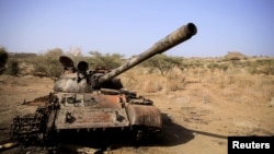 FILE - A destroyed tank is seen in a field in the aftermath of fighting between the Ethiopian National Defence Force and the Tigray People's Liberation Front (TPLF) forces in Kasagita town, in Afar region, Ethiopia, Feb. 25, 2022.
